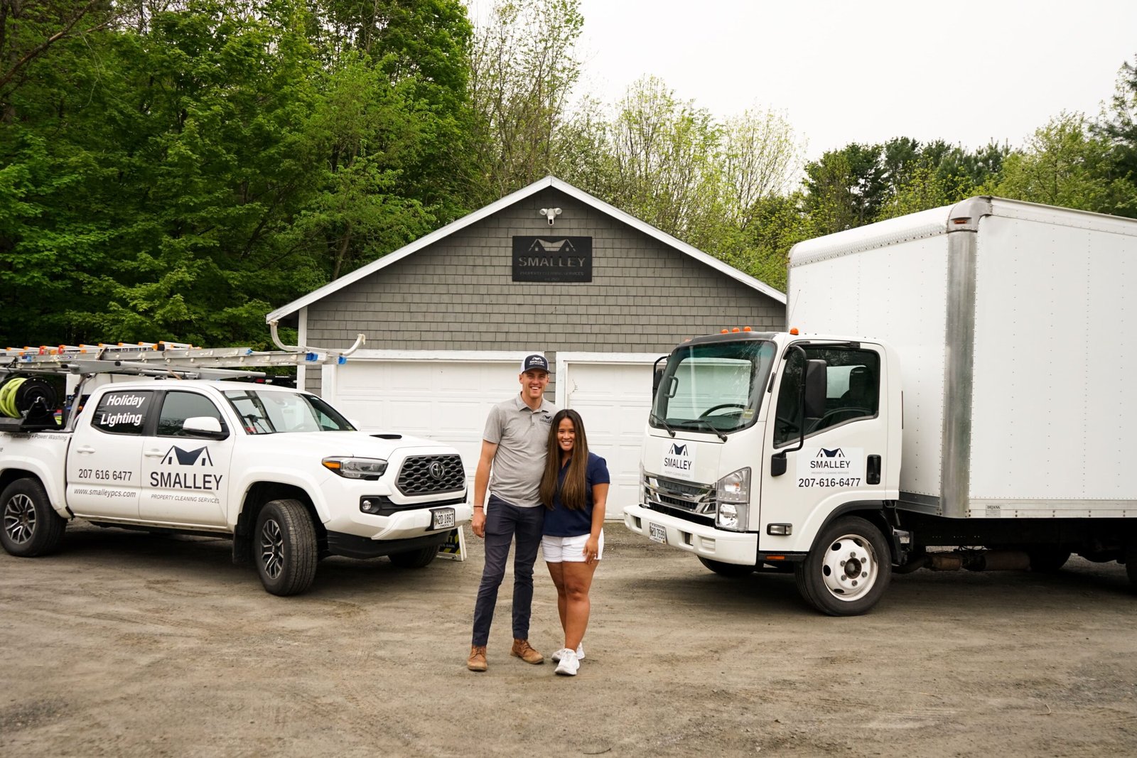 Smalley Property Cleaning team beside their service truck in Sidney, Maine