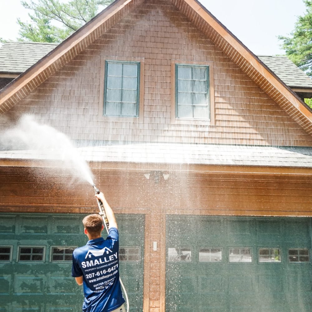 man washing a house